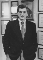 Larry Thomas McGehee standing in a suit